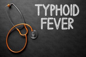 depositphotos 128937694 stock photo typhoid fever handwritten on chalkboard